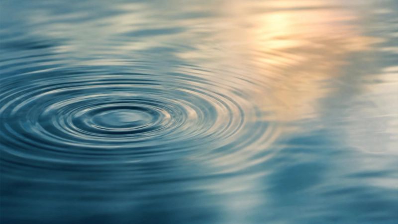 Abstract ripples on still water, symbolising intrusive thoughts that disturb the mind