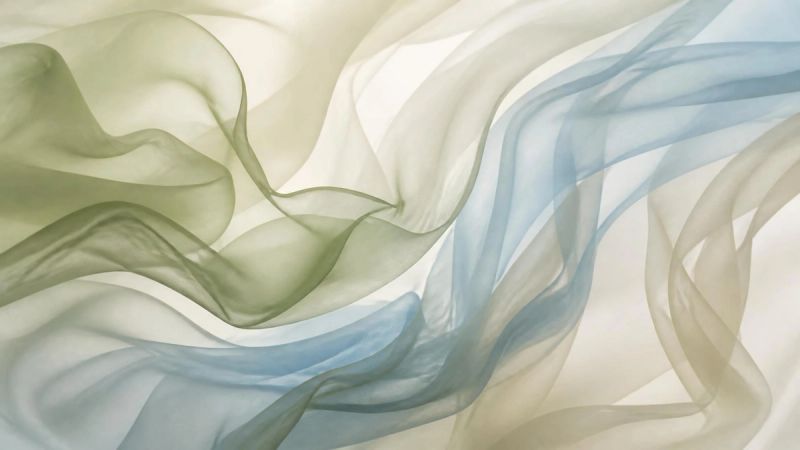 An abstract image of flowing curves in soft green and blue, representing hormonal changes