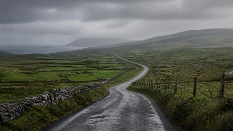 An empty Irish country road suggesting isolation and the difficulty of reaching out