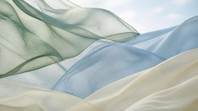 Abstract flowing fabric representing the hormonal transition of perimenopause