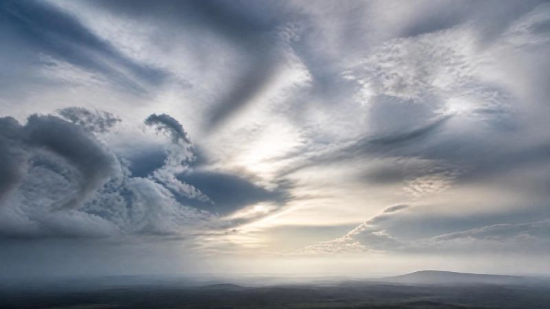Abstract photograph of turbulent clouds reflecting the physical feeling of menopause anxiety