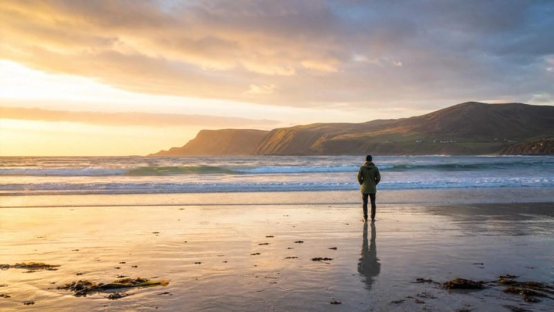 A person standing on a quiet Irish beach at sunrise, symbolising balance and wellbeing while taking ADHD medication.