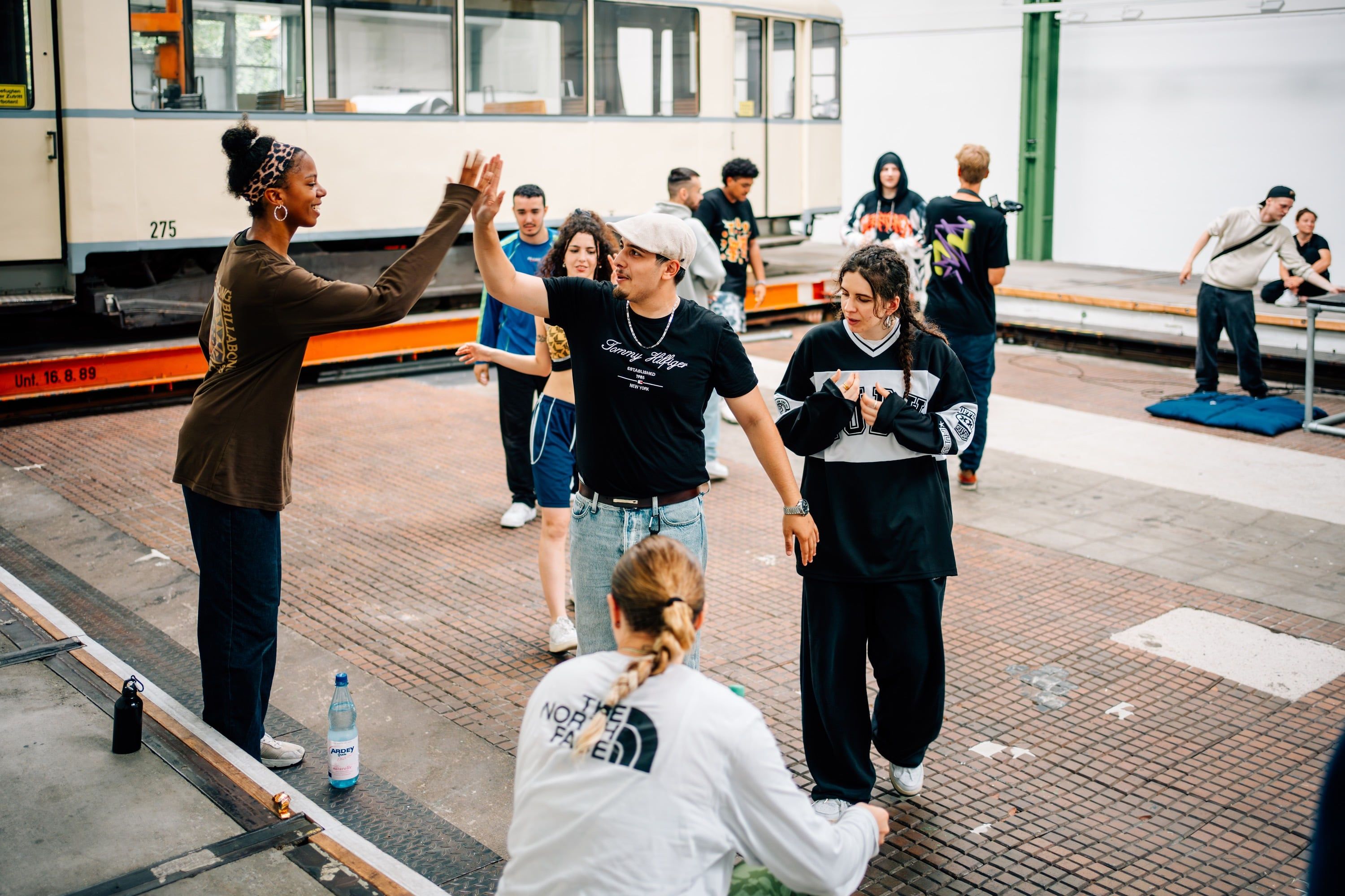 Young people giving each other a high five 