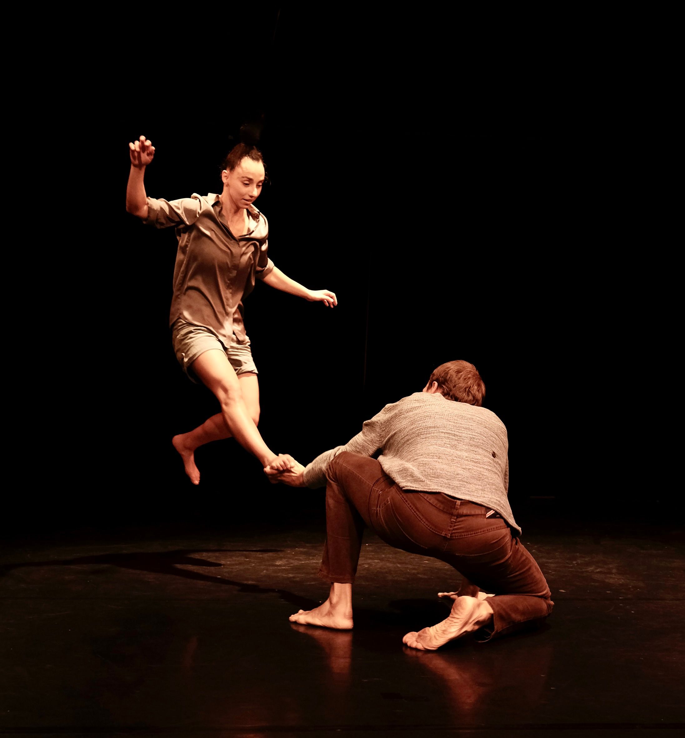 Two artists are shown during a performance.