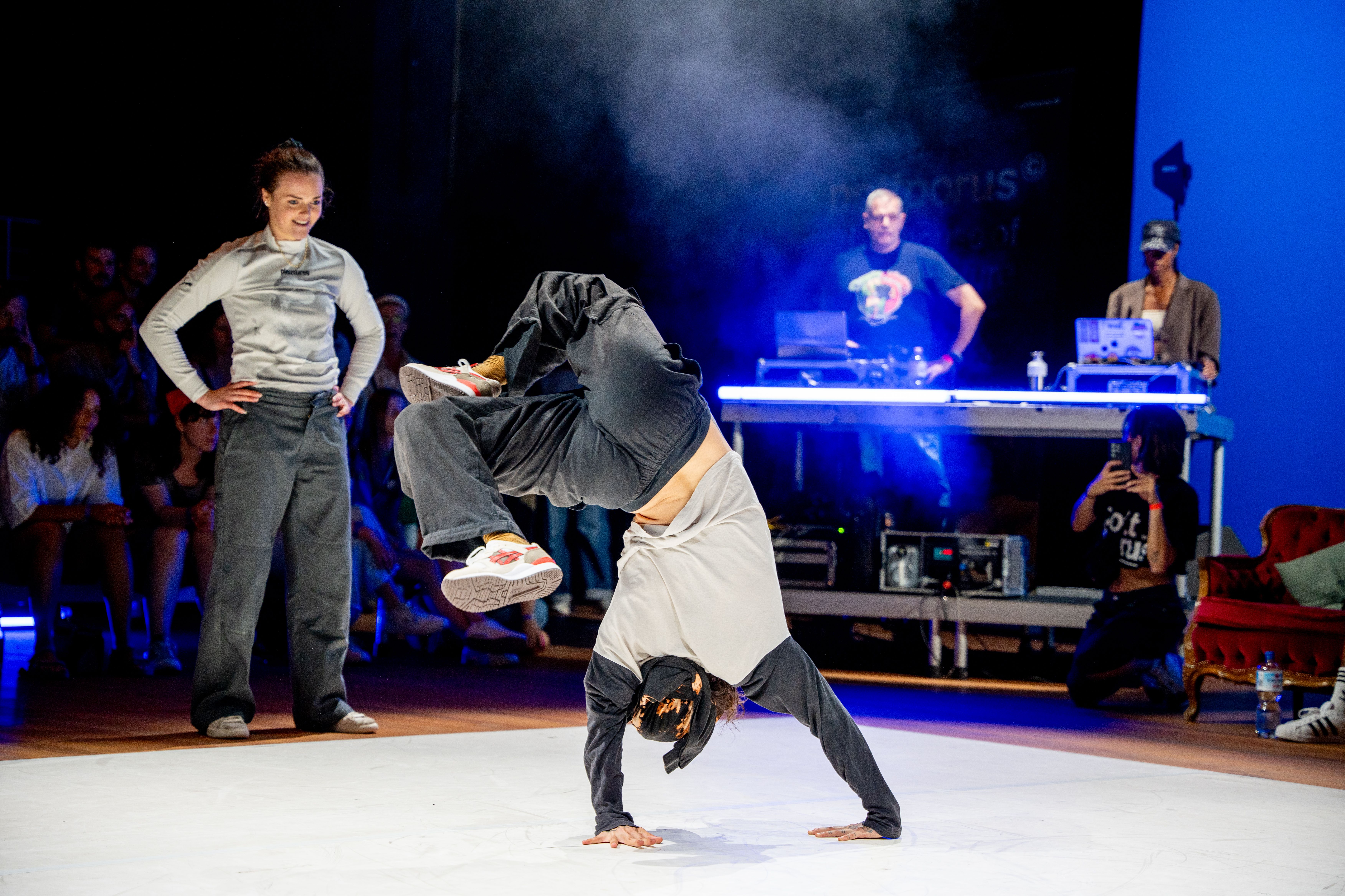 Person performing a dance move on stage