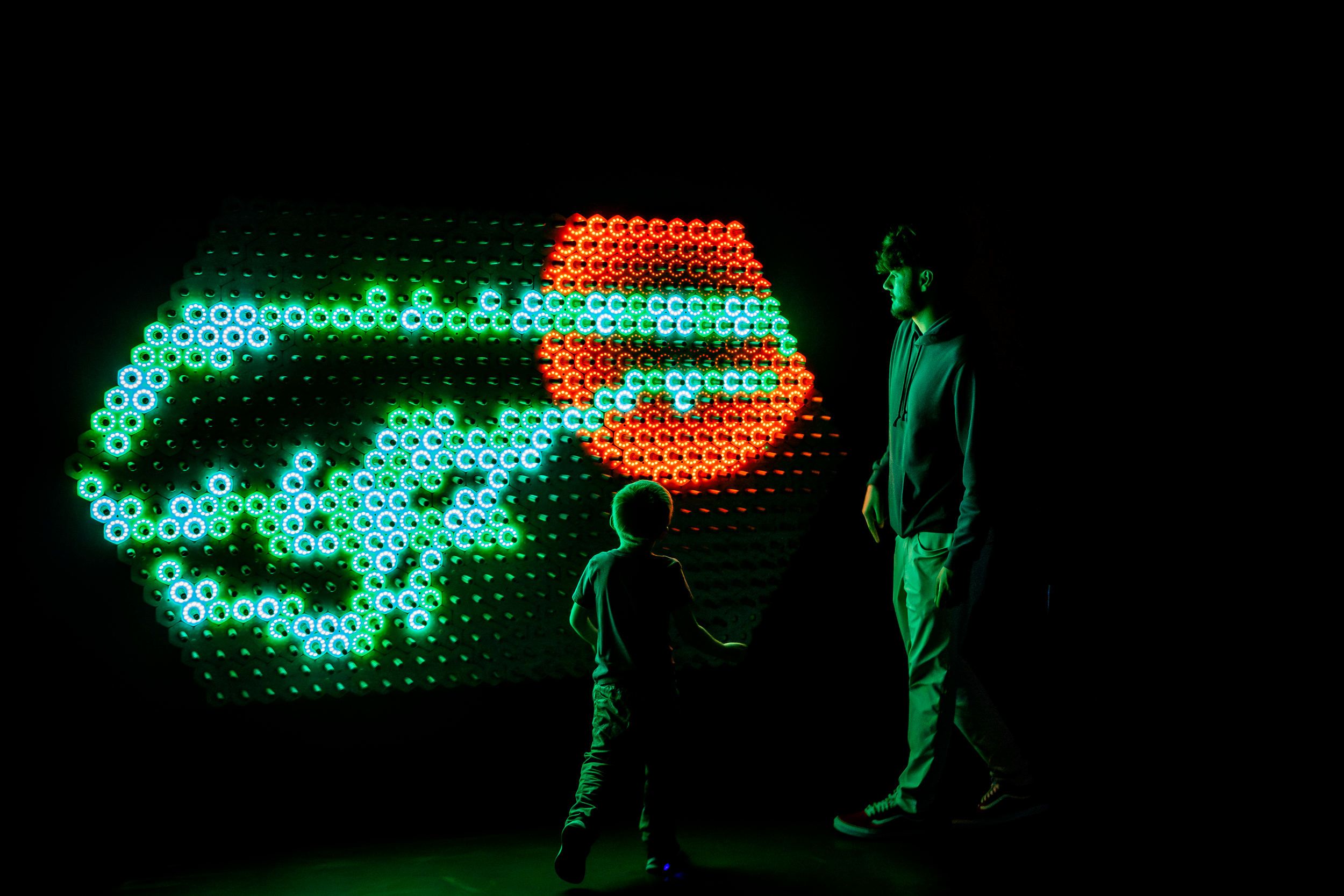 People in front of a video installation