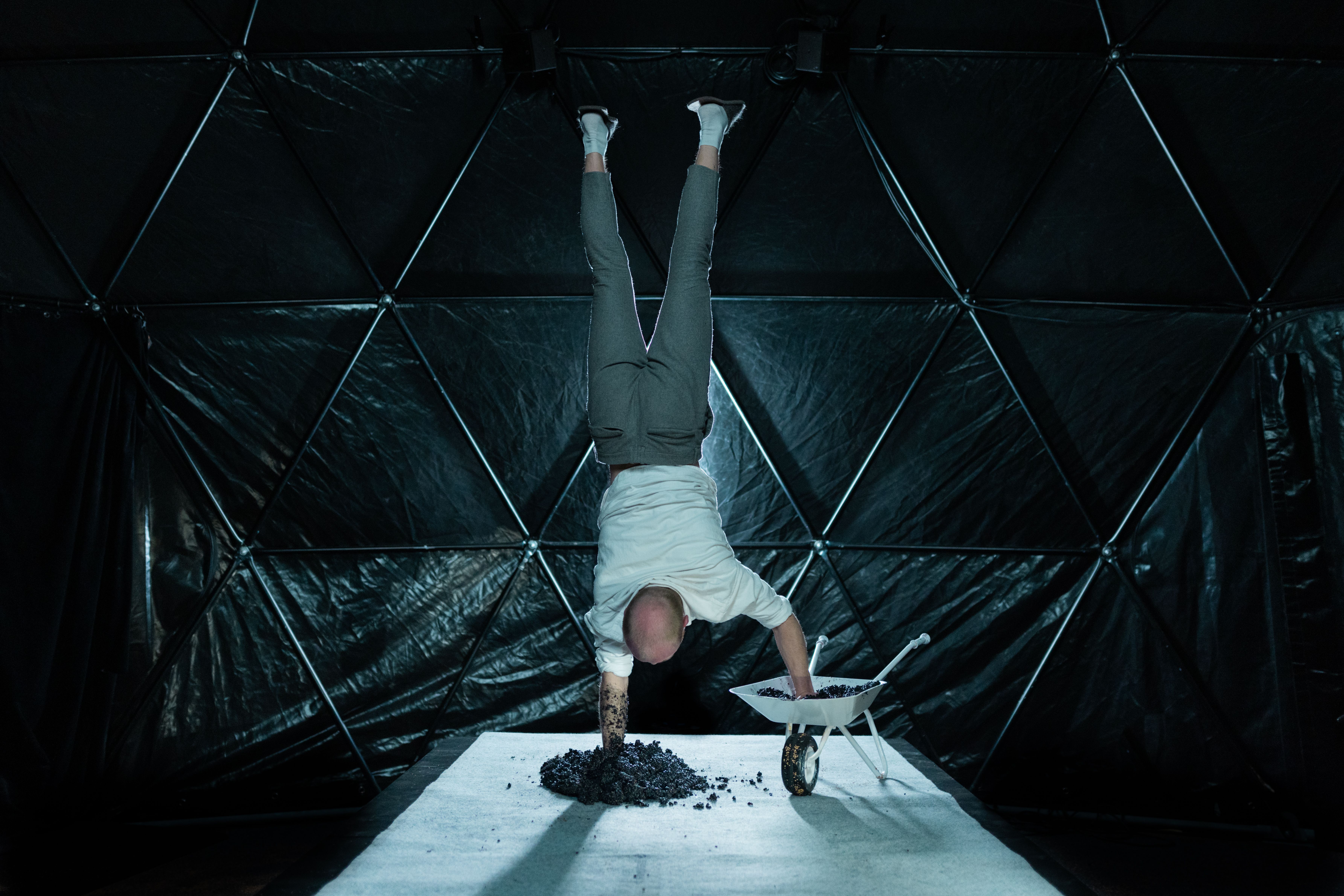 Artist doing a handstand