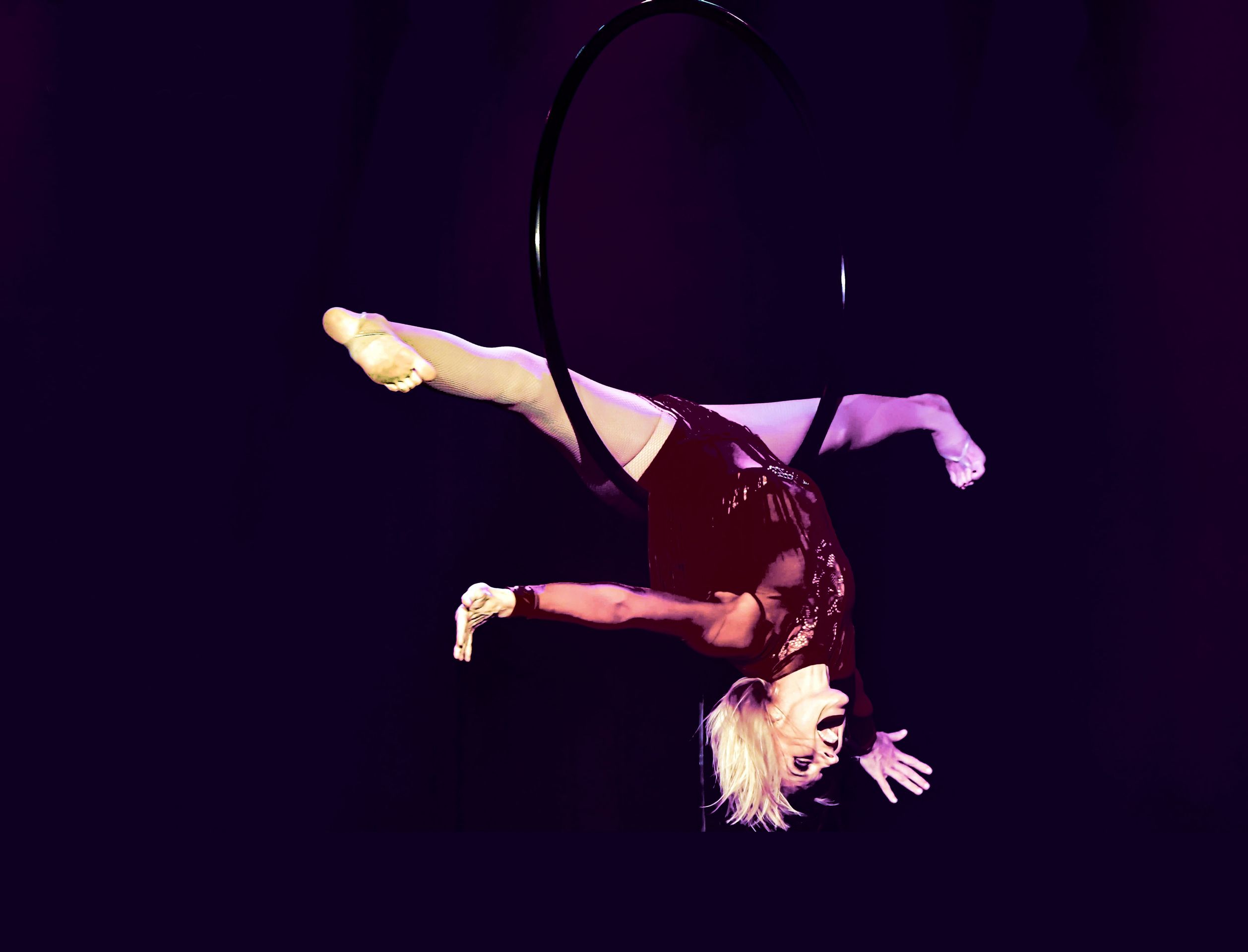 acrobat hanging in the air