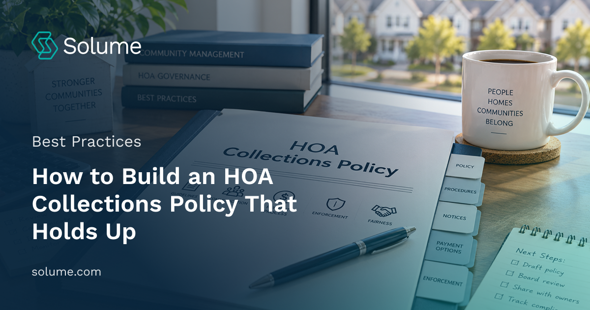 HOA collections policy binder with payment terms, late fees, notice procedures, and collections guidelines on a sunlit office desk with a calculator, pen, and community-themed decor.