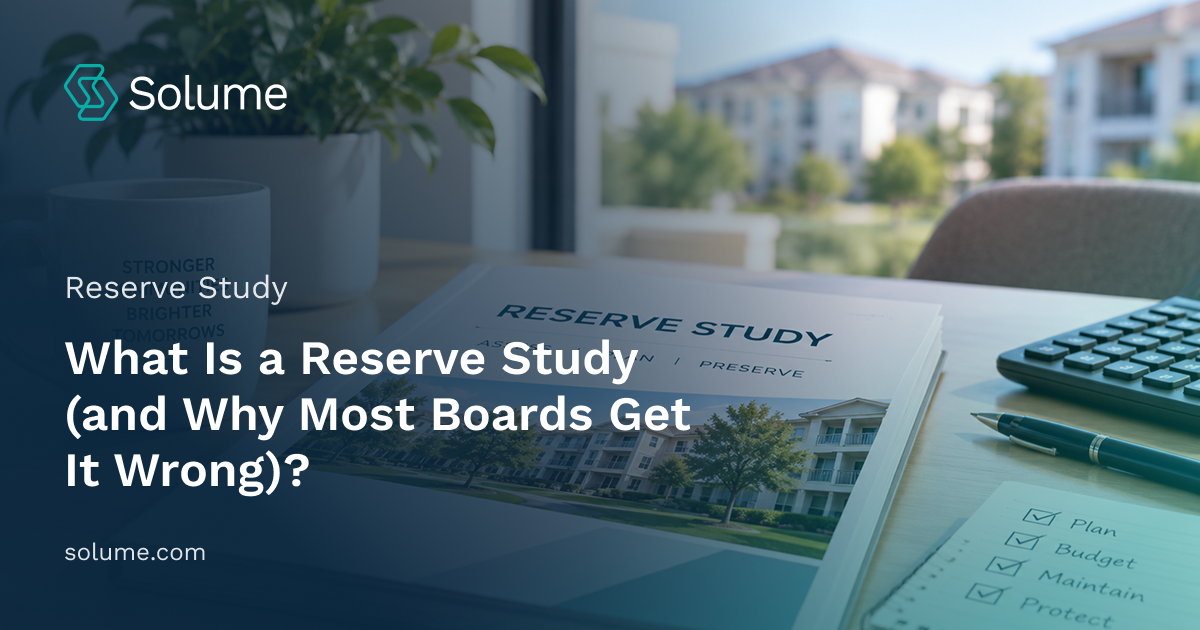 Reserve study report, calculator, checklist, and planning materials arranged on a desk with a condominium community visible through the window.