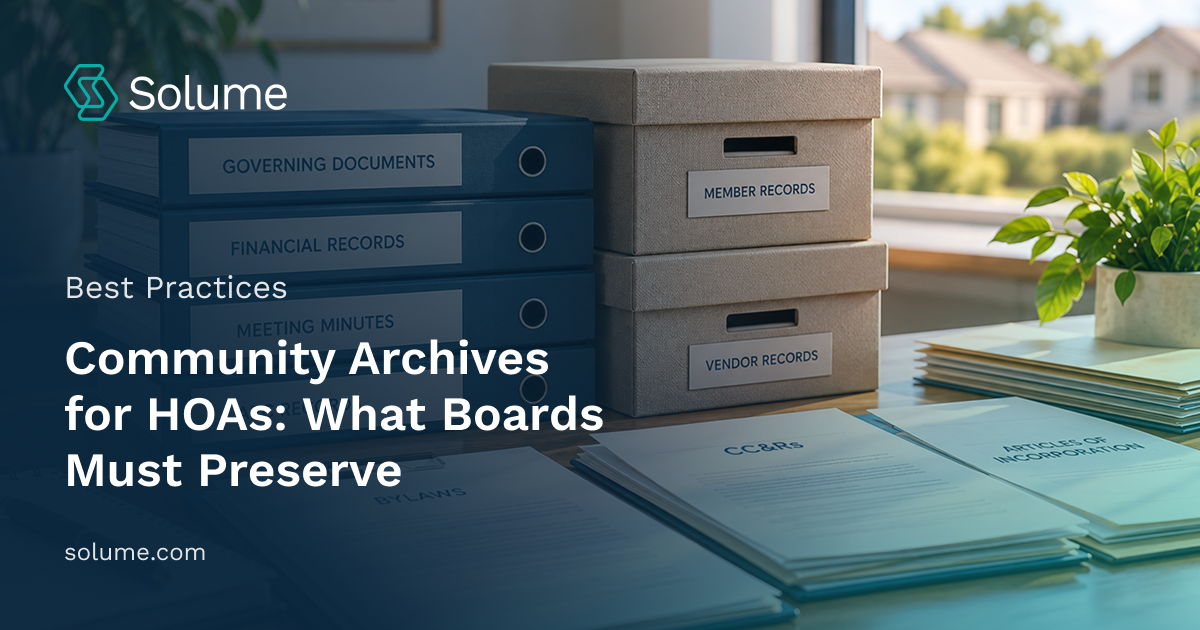 Organized HOA community archives featuring labeled blue binders, document storage boxes, and neatly arranged governing documents, financial records, meeting minutes, and association paperwork on an office desk.