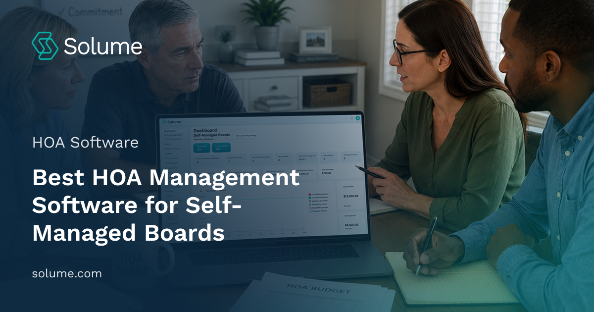 HOA board members reviewing self-managed community dashboard software on a laptop during a team meeting in a modern office setting.