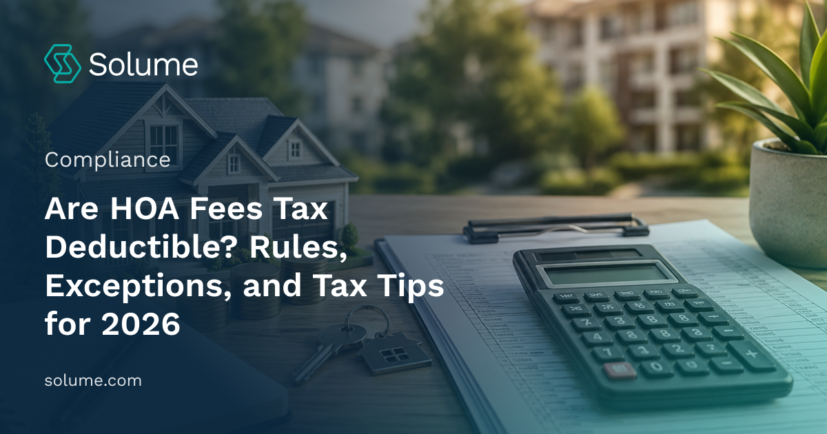 Model home with calculator, financial documents, coins, and house keys representing HOA fees and potential tax deductions.