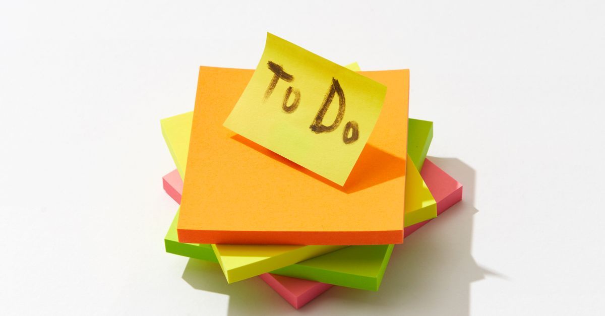 Colourful sticky-note pads with a to-do note on top.