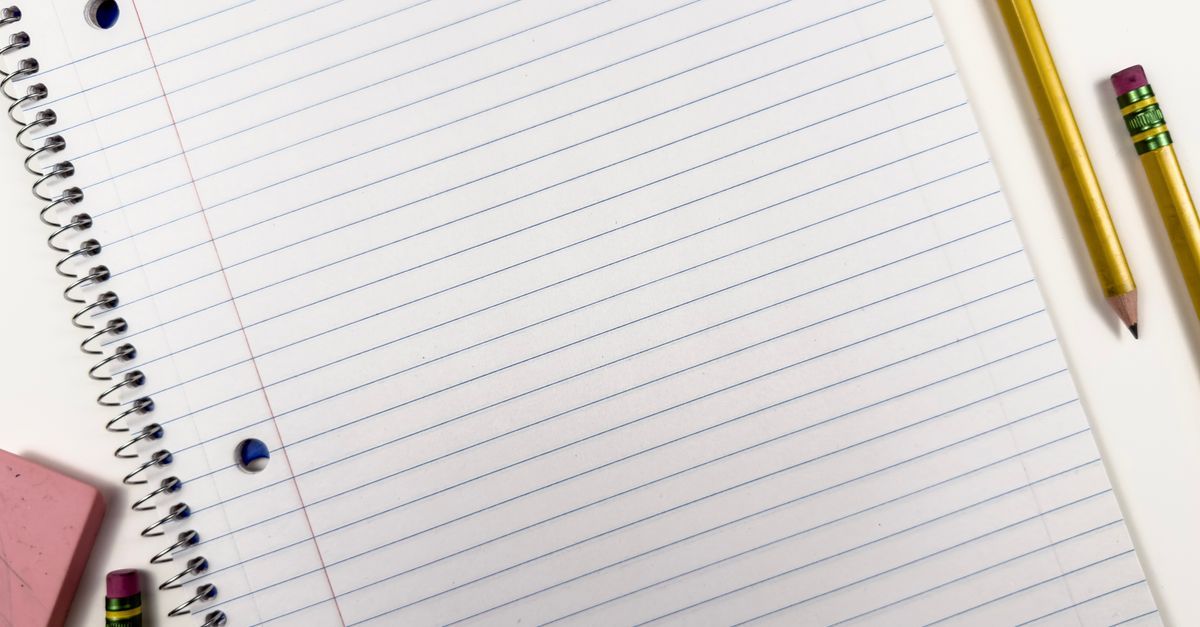 A spiral notebook with pencils and an eraser, viewed from above.