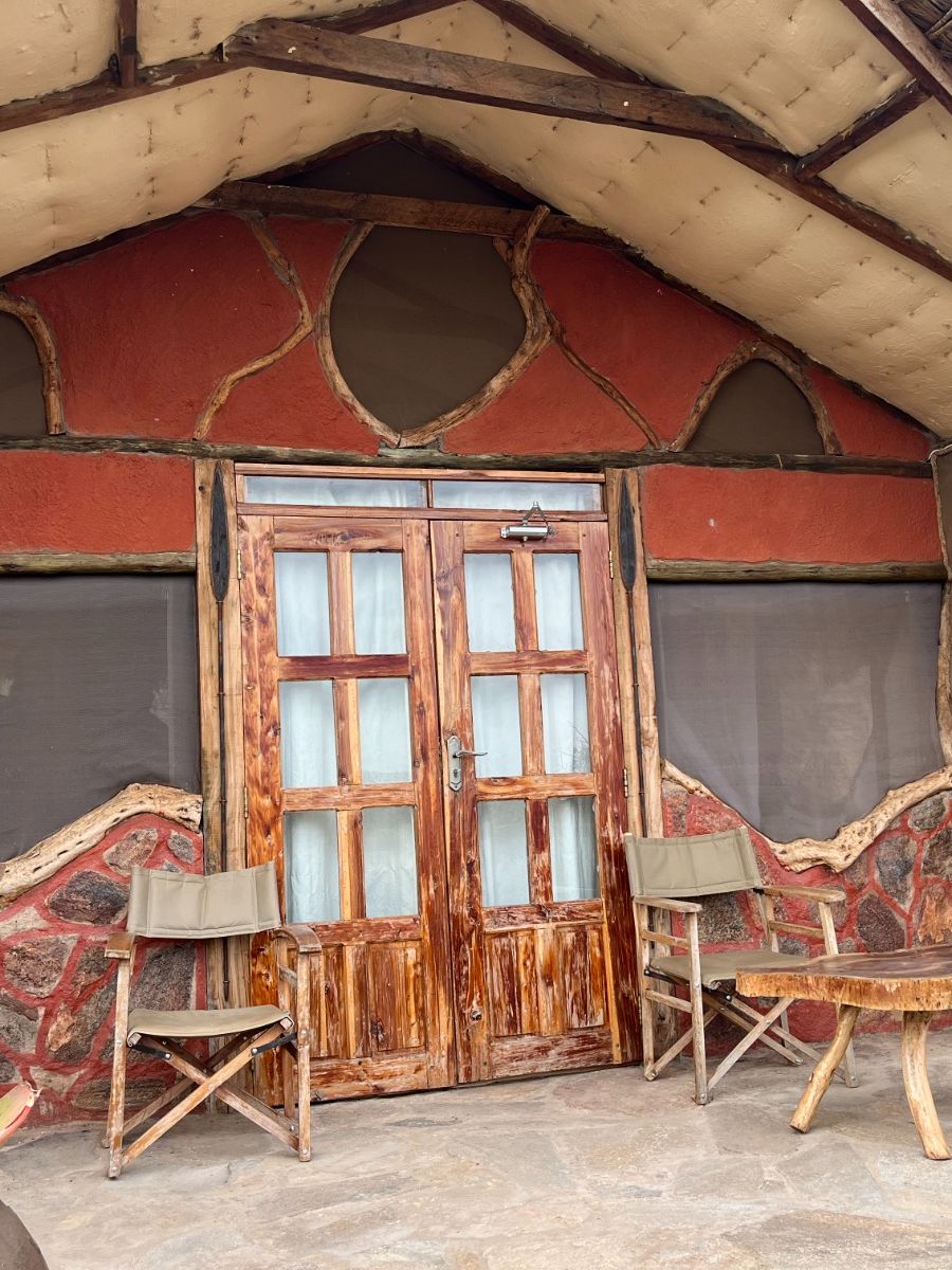 Rustic cabin with stone and wood patio