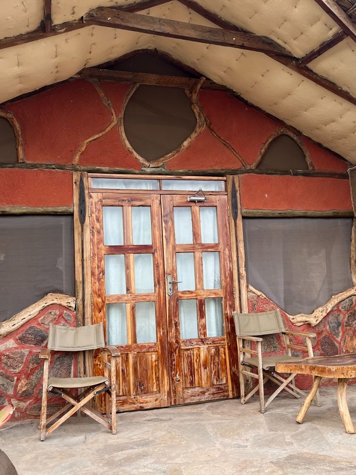 Rustic cabin with stone and wood patio