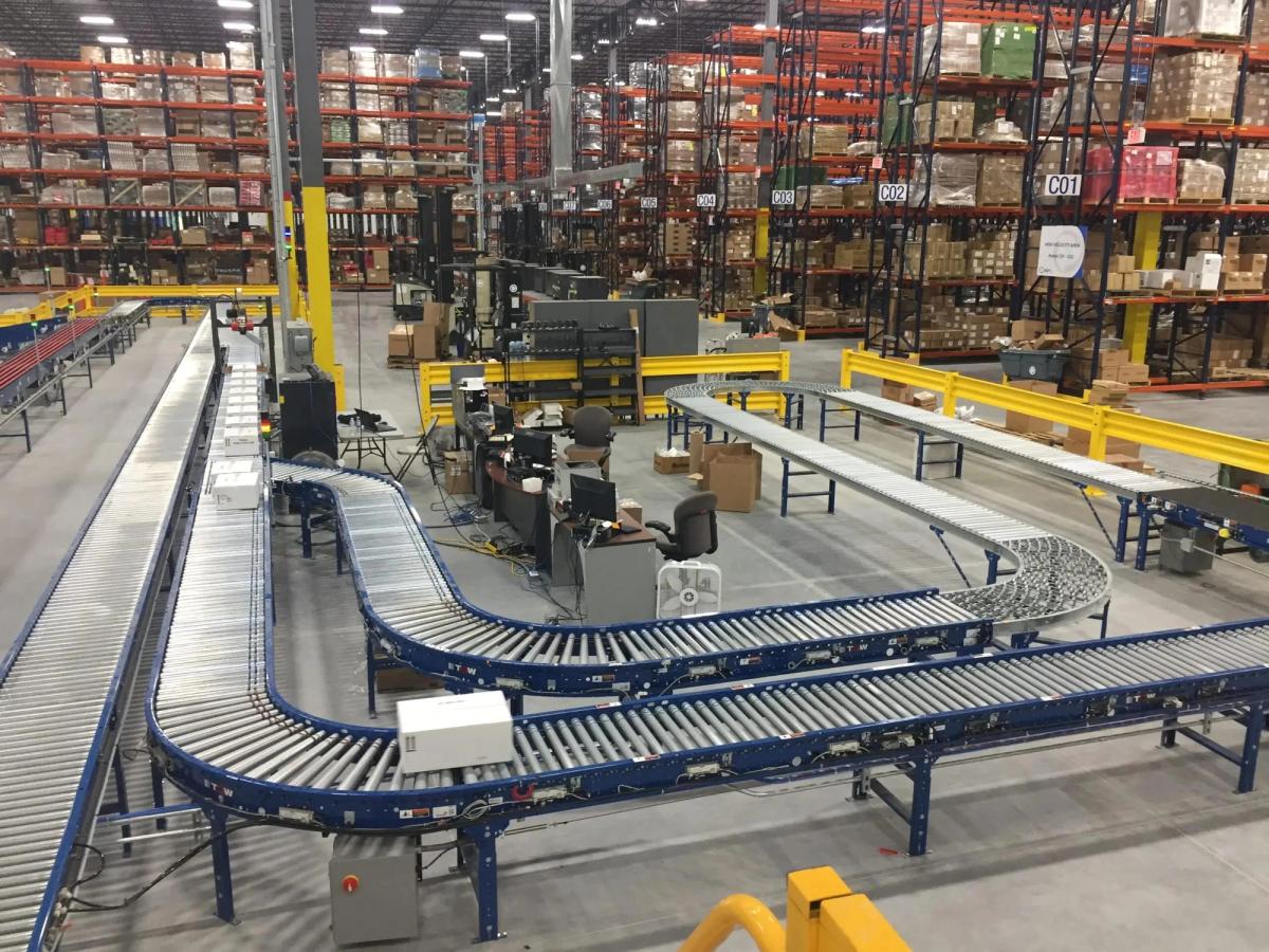 Conveyor network supporting warehouse sorting and internal flow