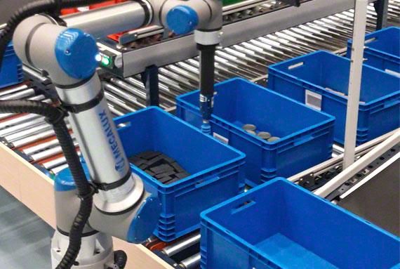 Robotic arm picking items from blue totes on a conveyor