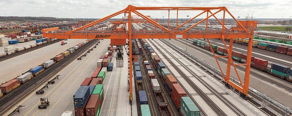 Intermodal rail terminal with container handling crane