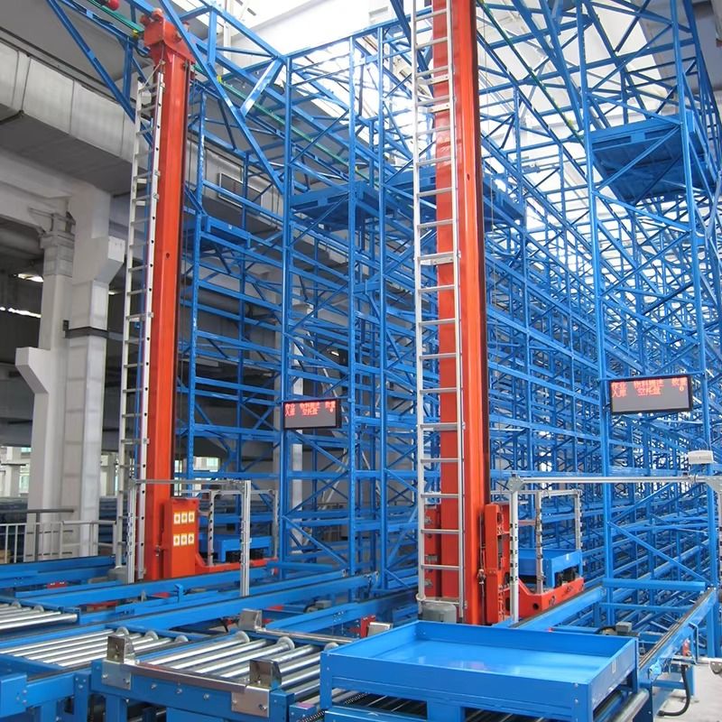 Automated stacker crane operating beside high-bay racking in an automated warehouse