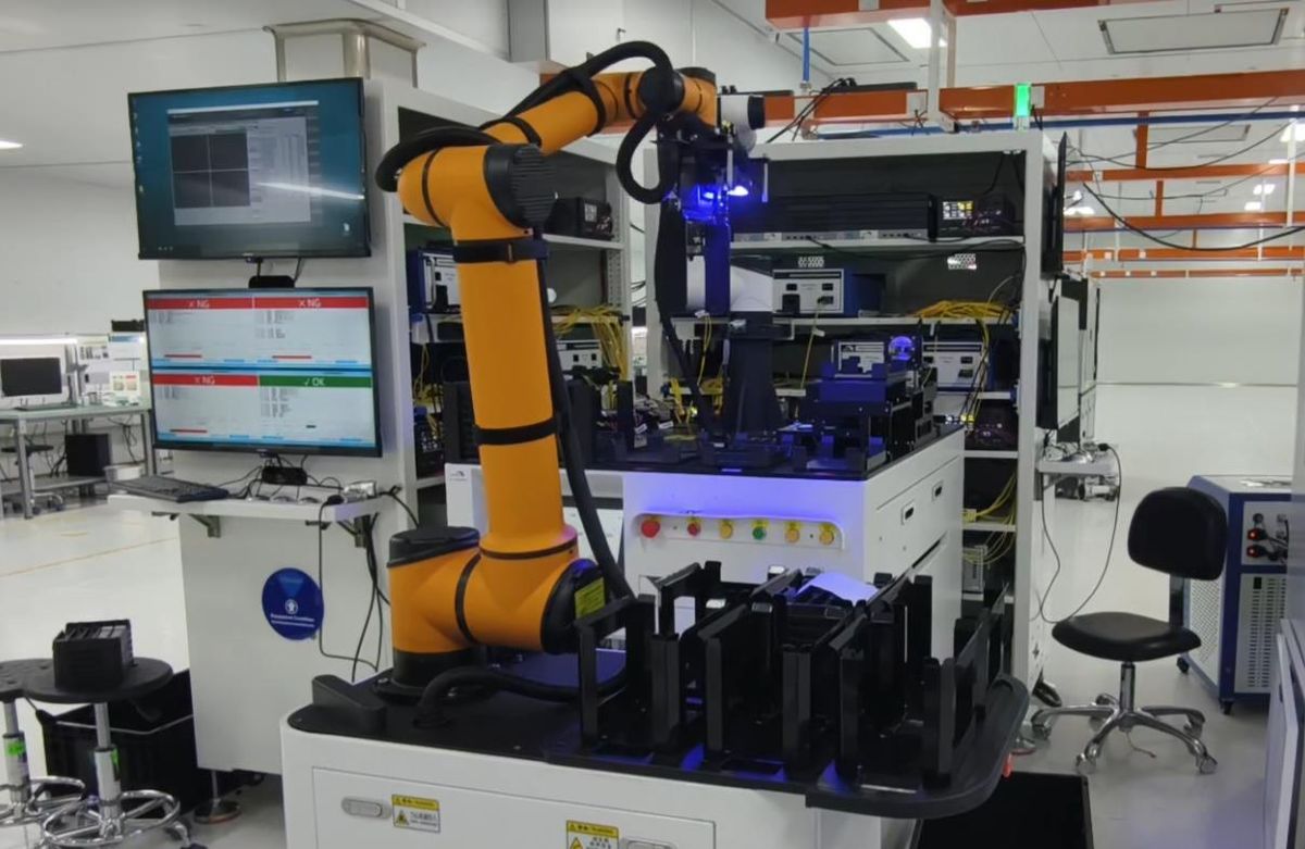 Composite robot and AGV docking transfer cell with machine-side testing equipment and pallet buffers