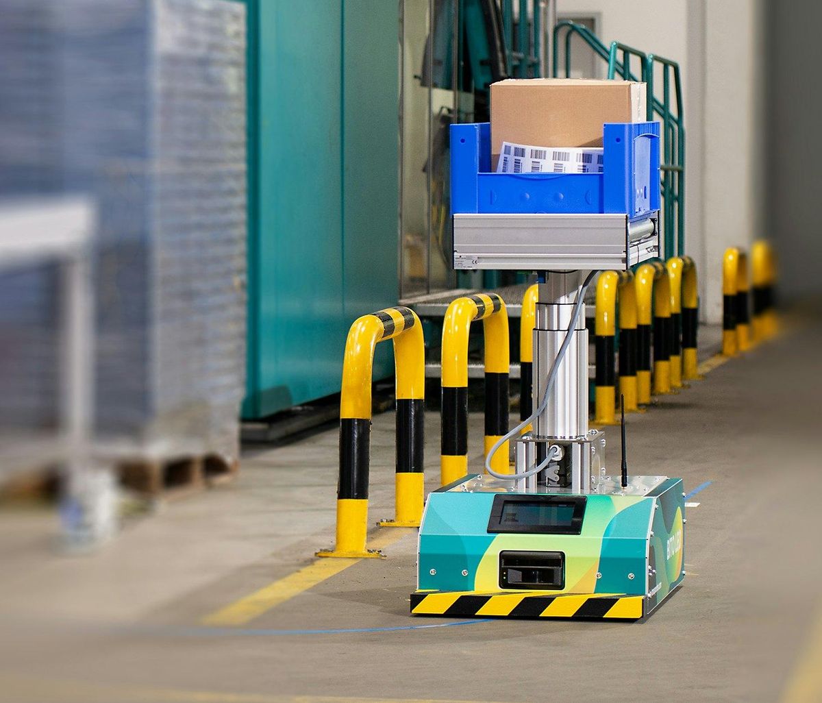 Autonomous guided vehicle moving a tote in a warehouse