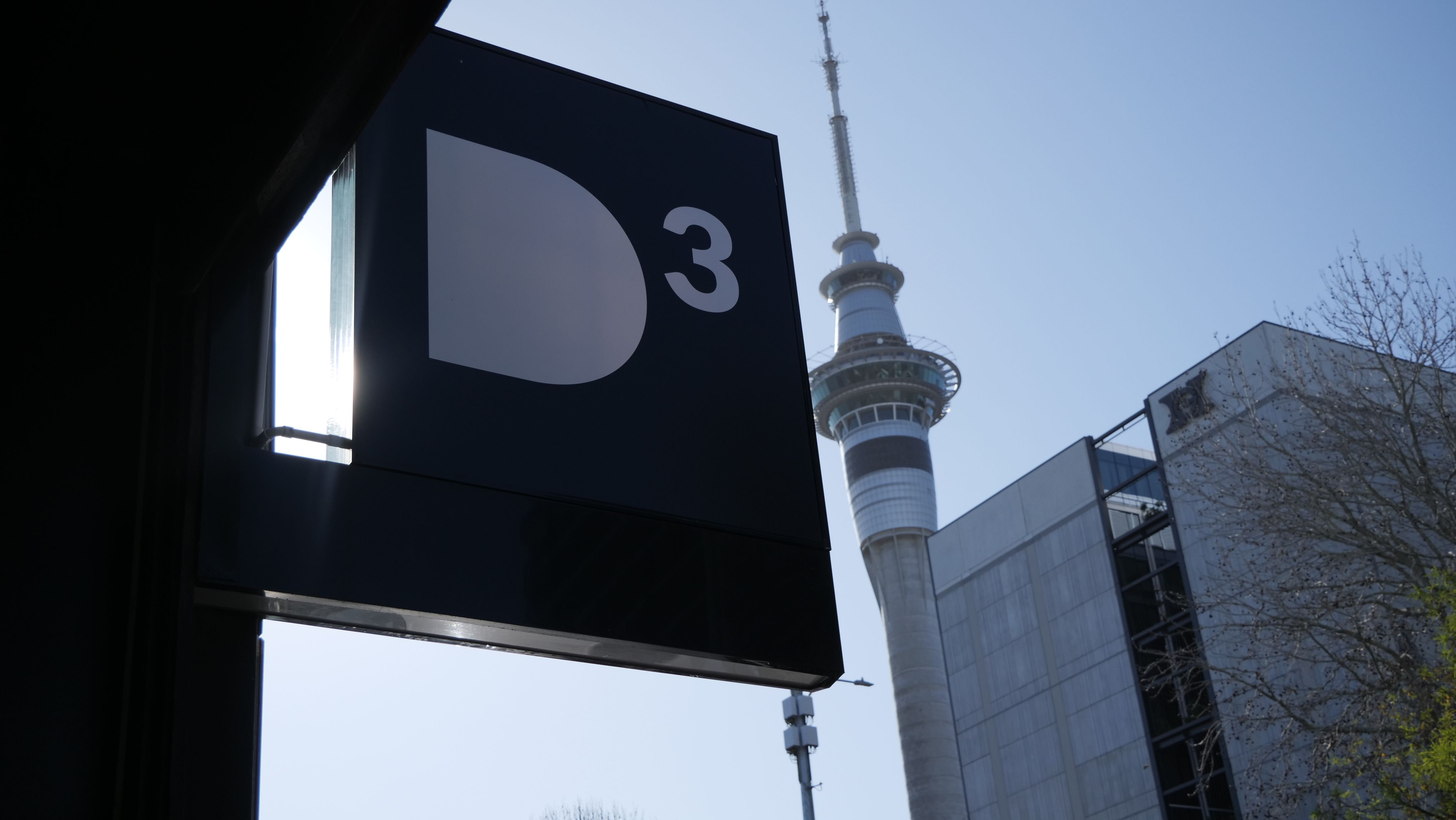 D3 office signage with Auckland's Sky Tower in background