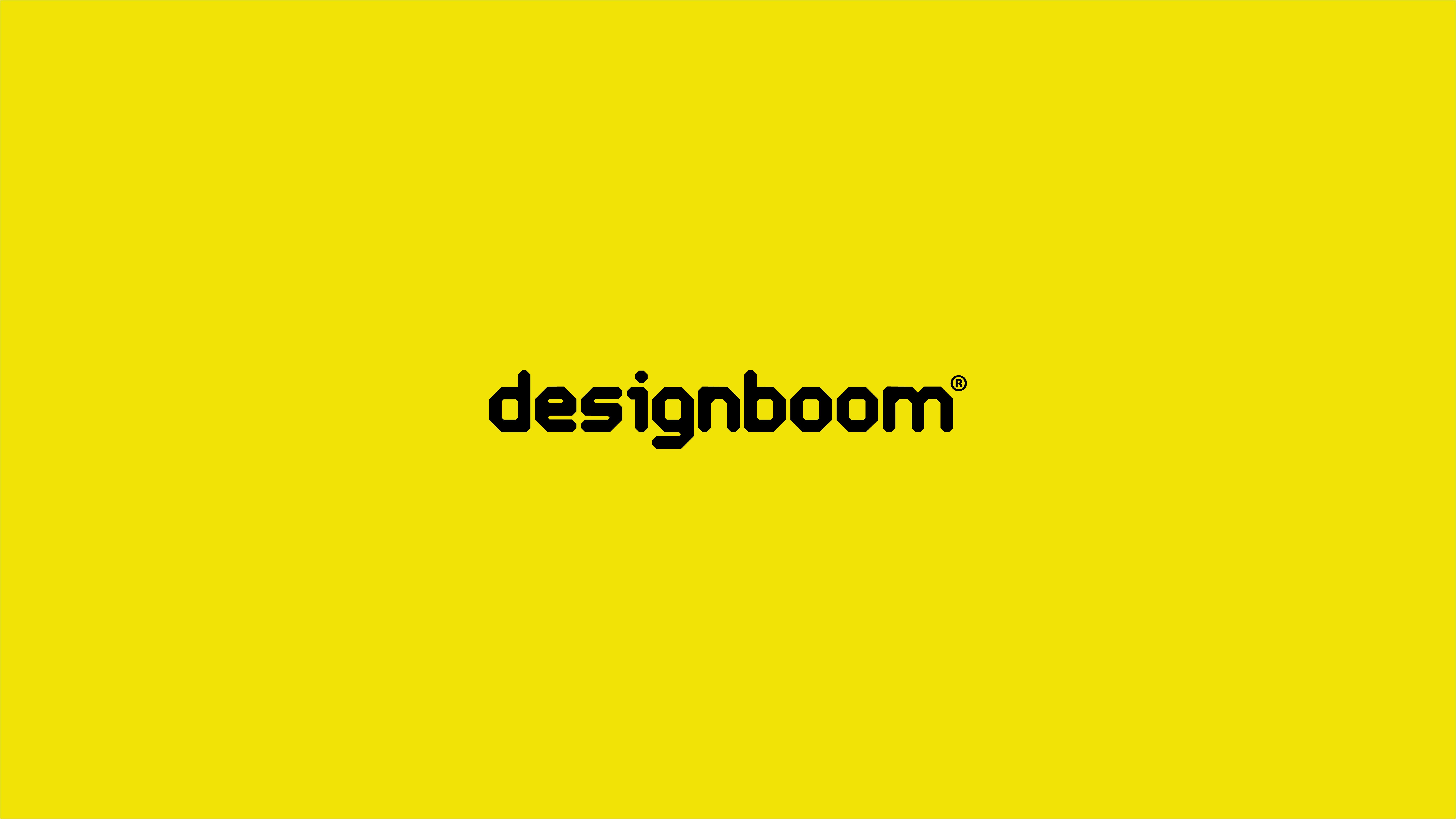 The word designboom on a yellow background