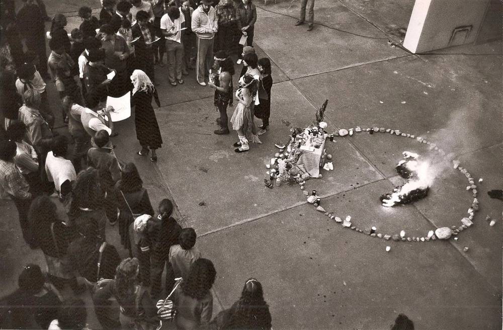 Aerial shot of a Poyesis Genetica performance involving a crowd of attendees.