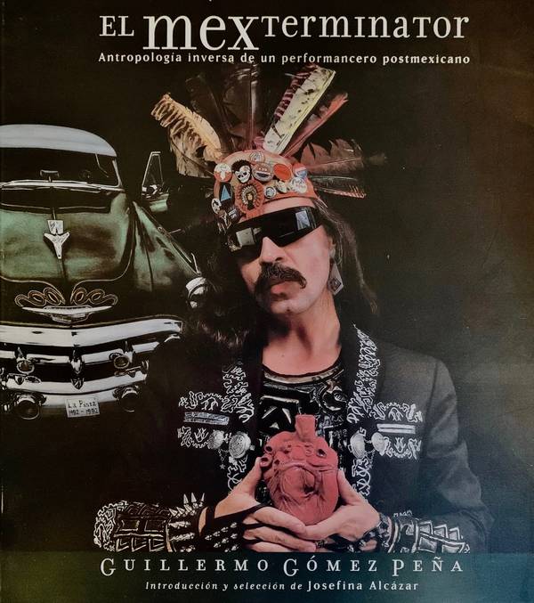 Book cover of GGP holding a read heart artifact with feathered head dress and green vintage car behind.