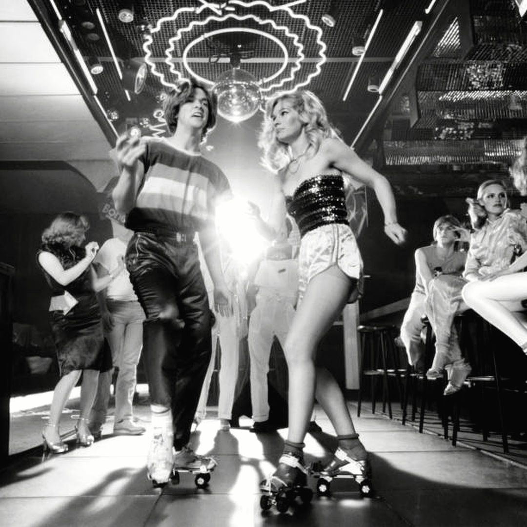 1970s disco dancers wearing halter tops