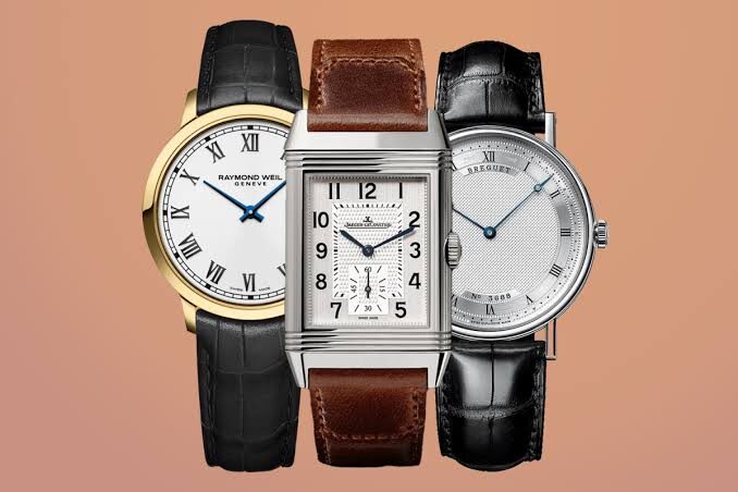 Three slim dress watches in the 34mm to 38mm range, representing the 2026 shift in case-size preference.