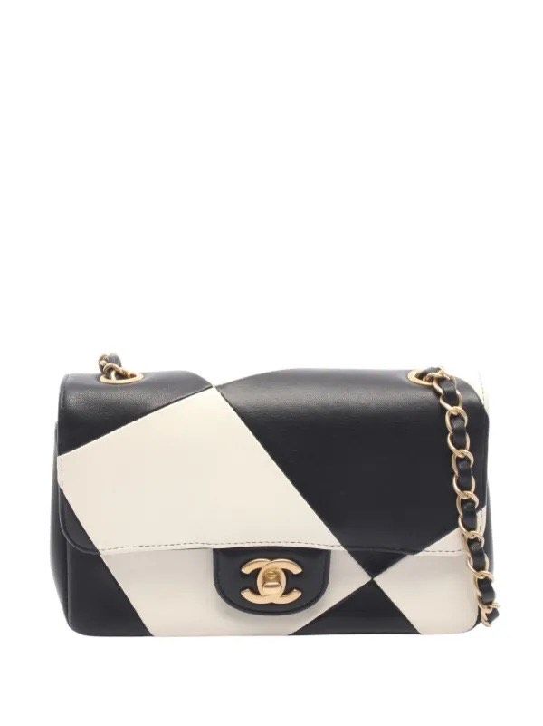 A Chanel classic flap bag photographed in black and white. No styling just the object in isolation against a neutral background.