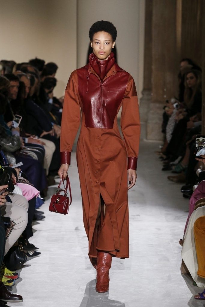 A model in Terracotta and warm earth tones, SS2027