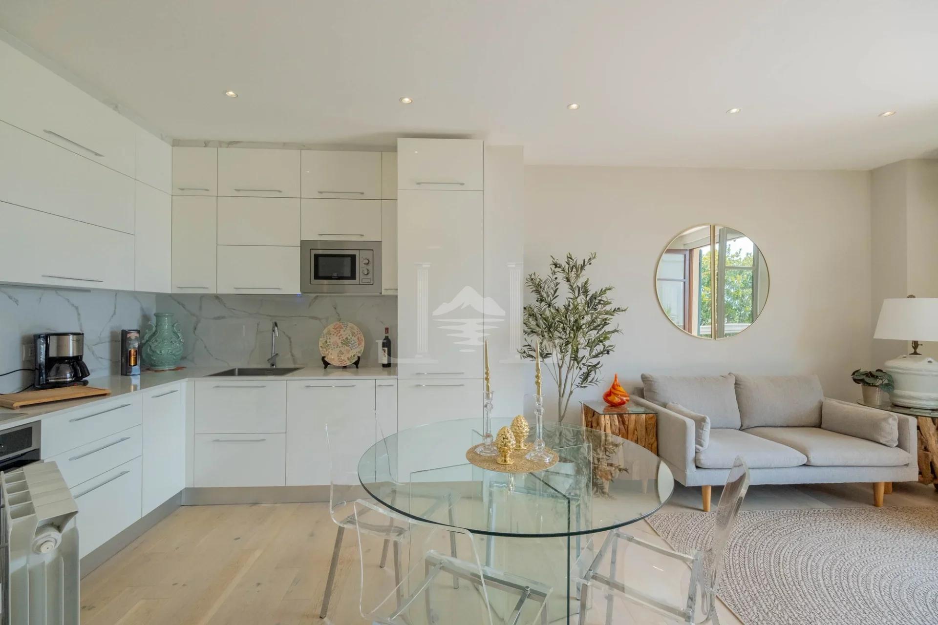 Dining and living area viewed from the kitchen, Via Solferino, Suna