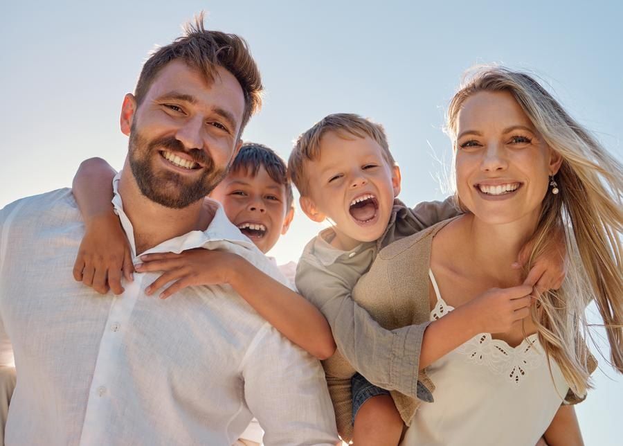 Happy family, portrait outdoors looking for family dentist in San Francisco