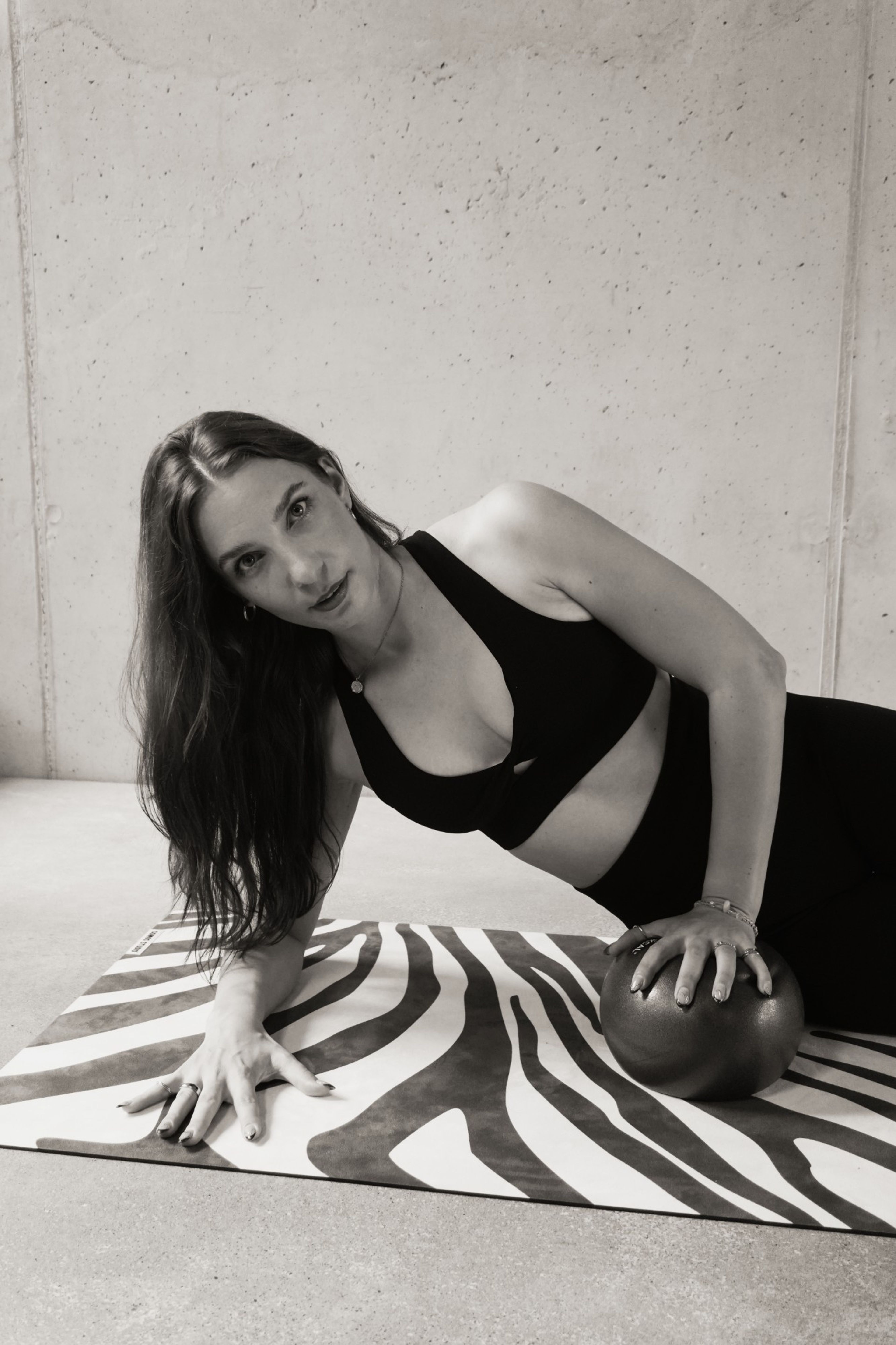 Corinna from Salt8 on the mat with a Pilates ball