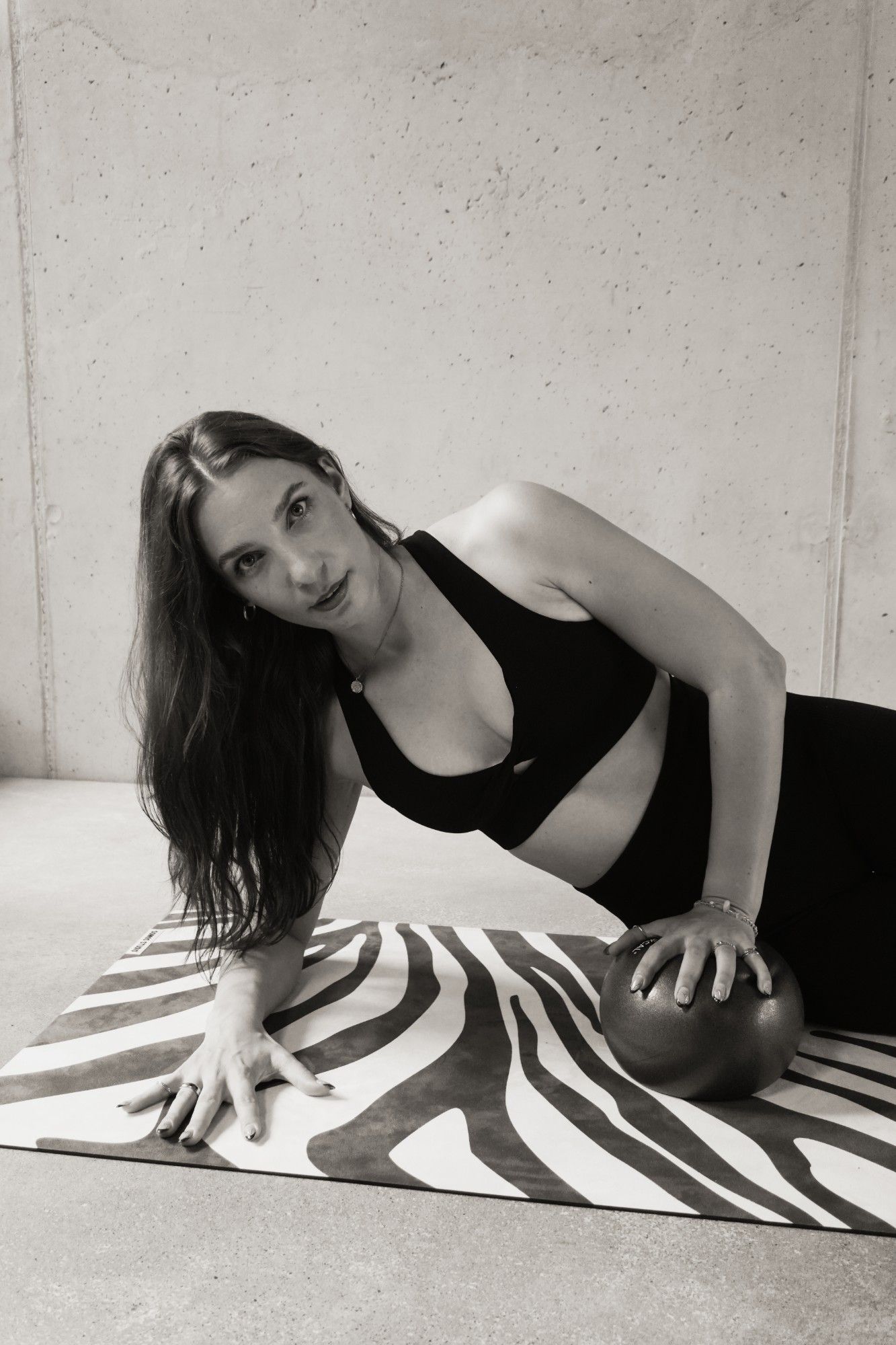 Corinna from Salt8 on the mat with a Pilates ball