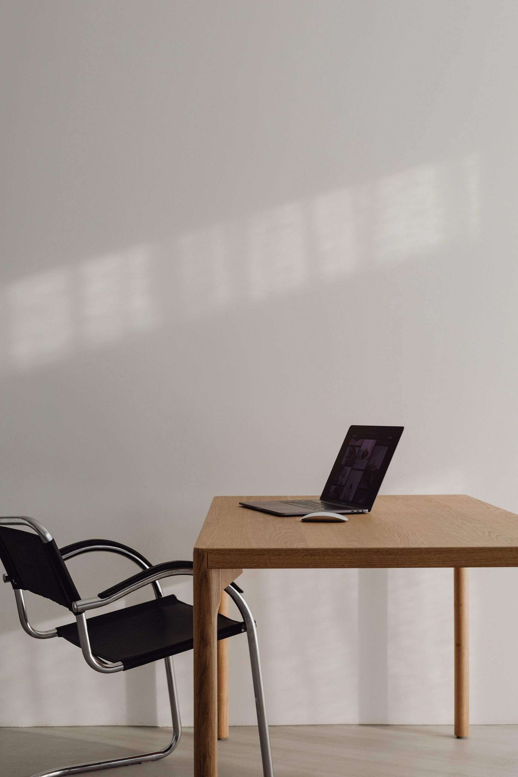 Minimal wooden desk with a laptop