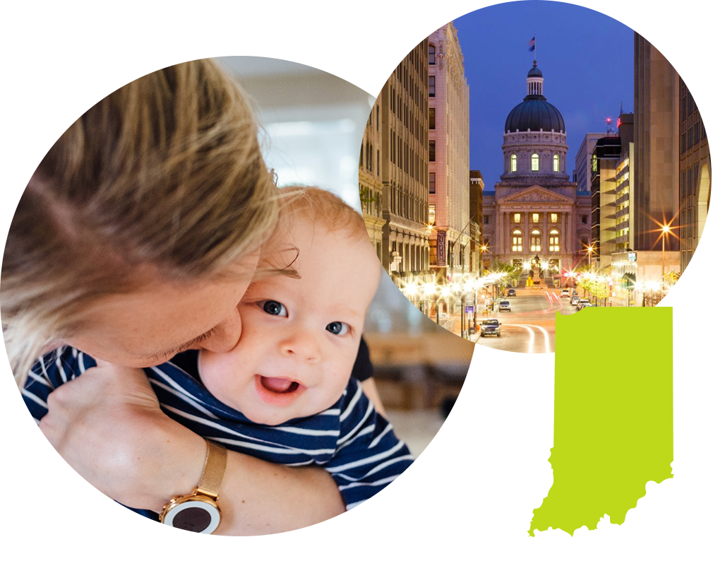 Mother kissing baby next to photo of downtown Indianapolis in Indiana.