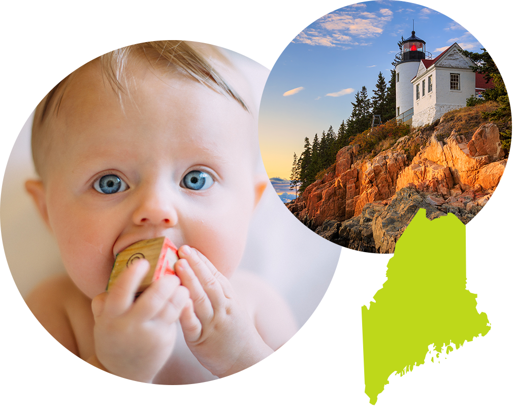 Baby boy with blue eyes sucking on a toy block next to image of a lighthouse in Maine.