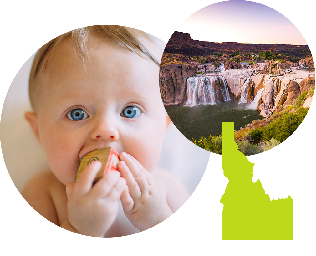 Baby boy with blue eyes sucking on a letter block next to image waterfalls in Idaho.