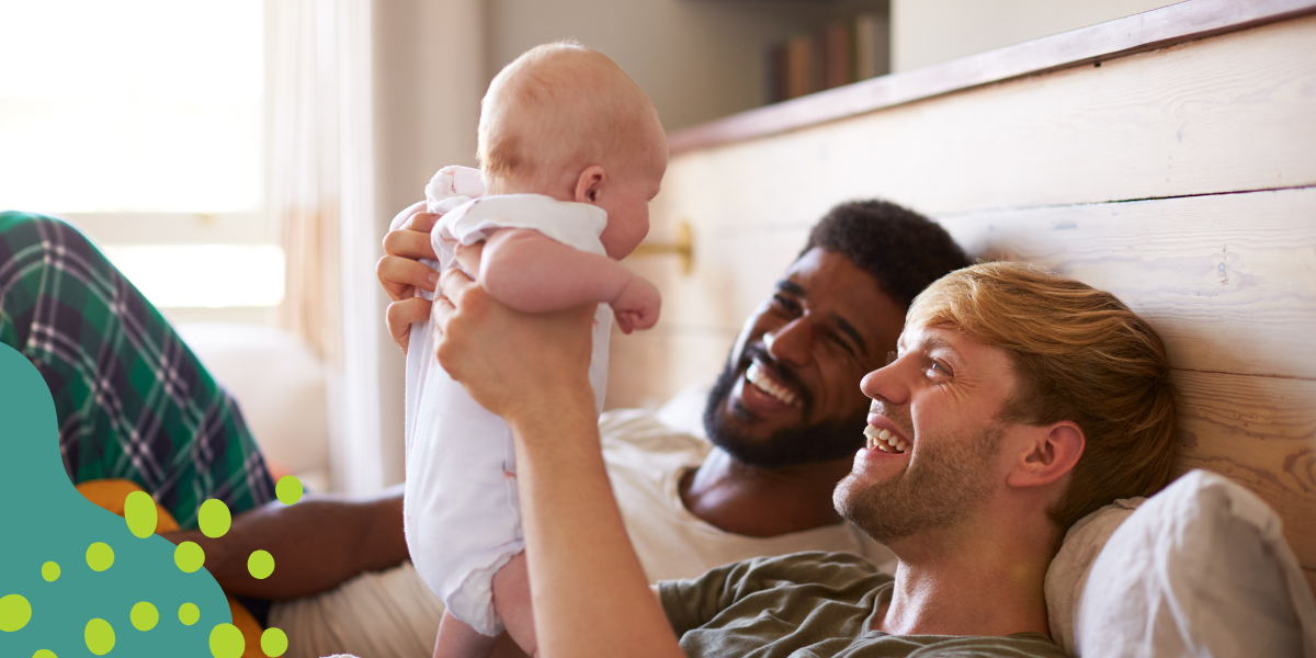 gay couple caring for their adopted baby