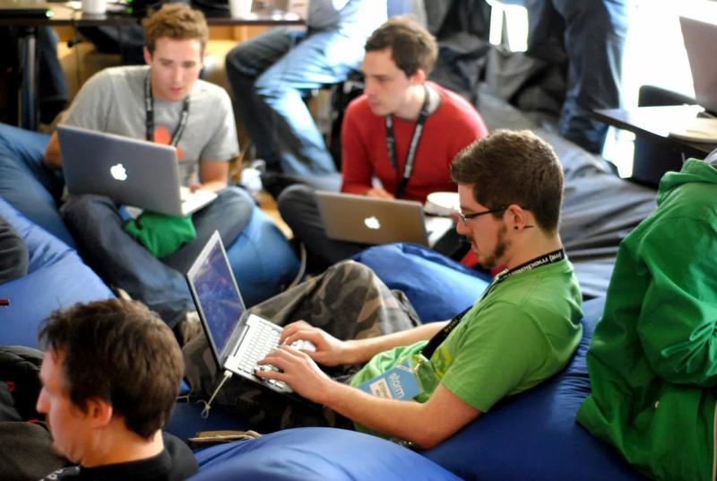 Team with laptops in the office