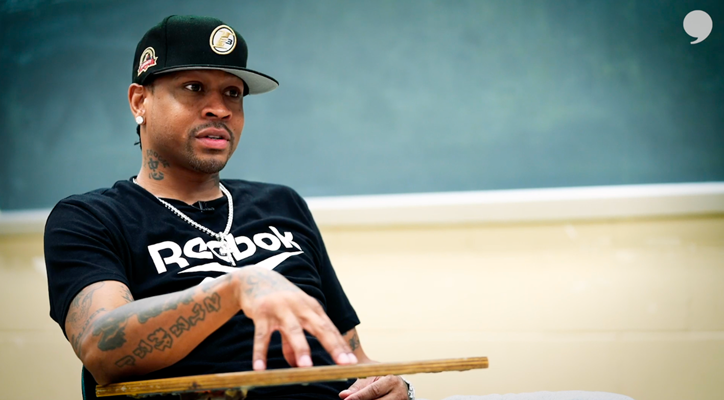 nba hall of famer allen iverson sitting for an interview at a school desk