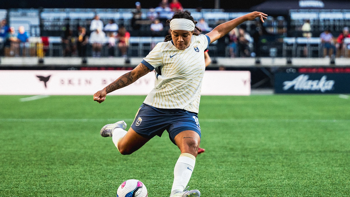 soccer player winding up for hard kick