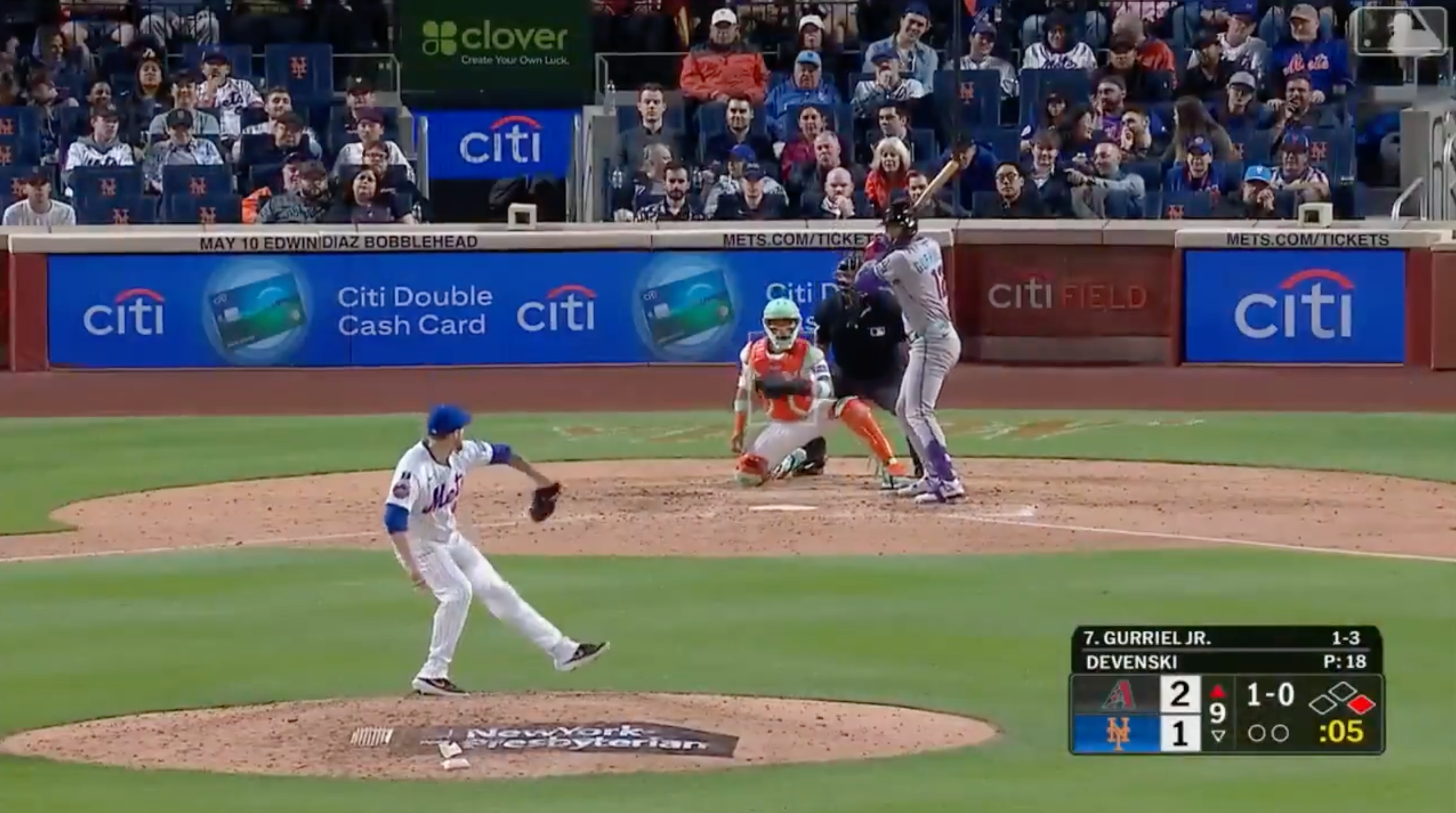 pitcher actively throwing pitch to batter