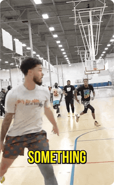 player making an athletic dunk in a local gym