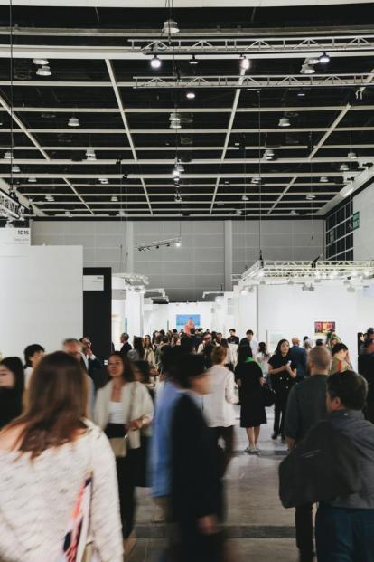 People walking through a conference hall
